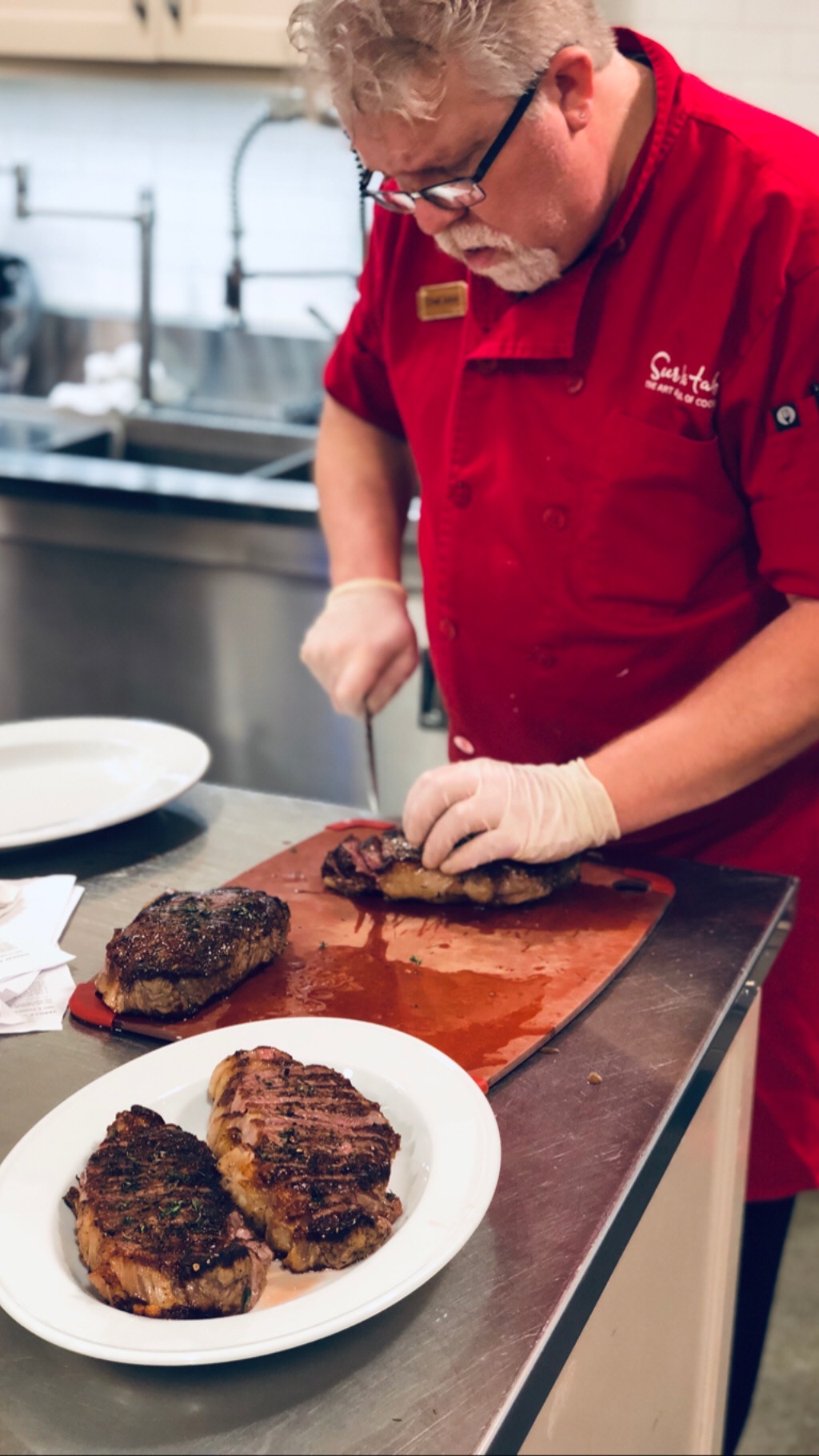 chef cutting steak